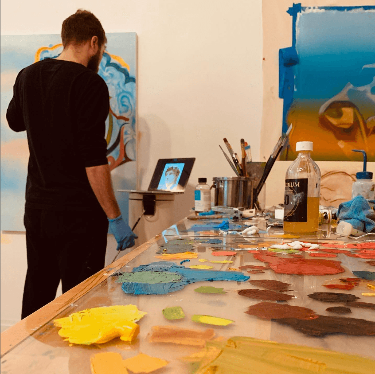 Julian painting at the easel.