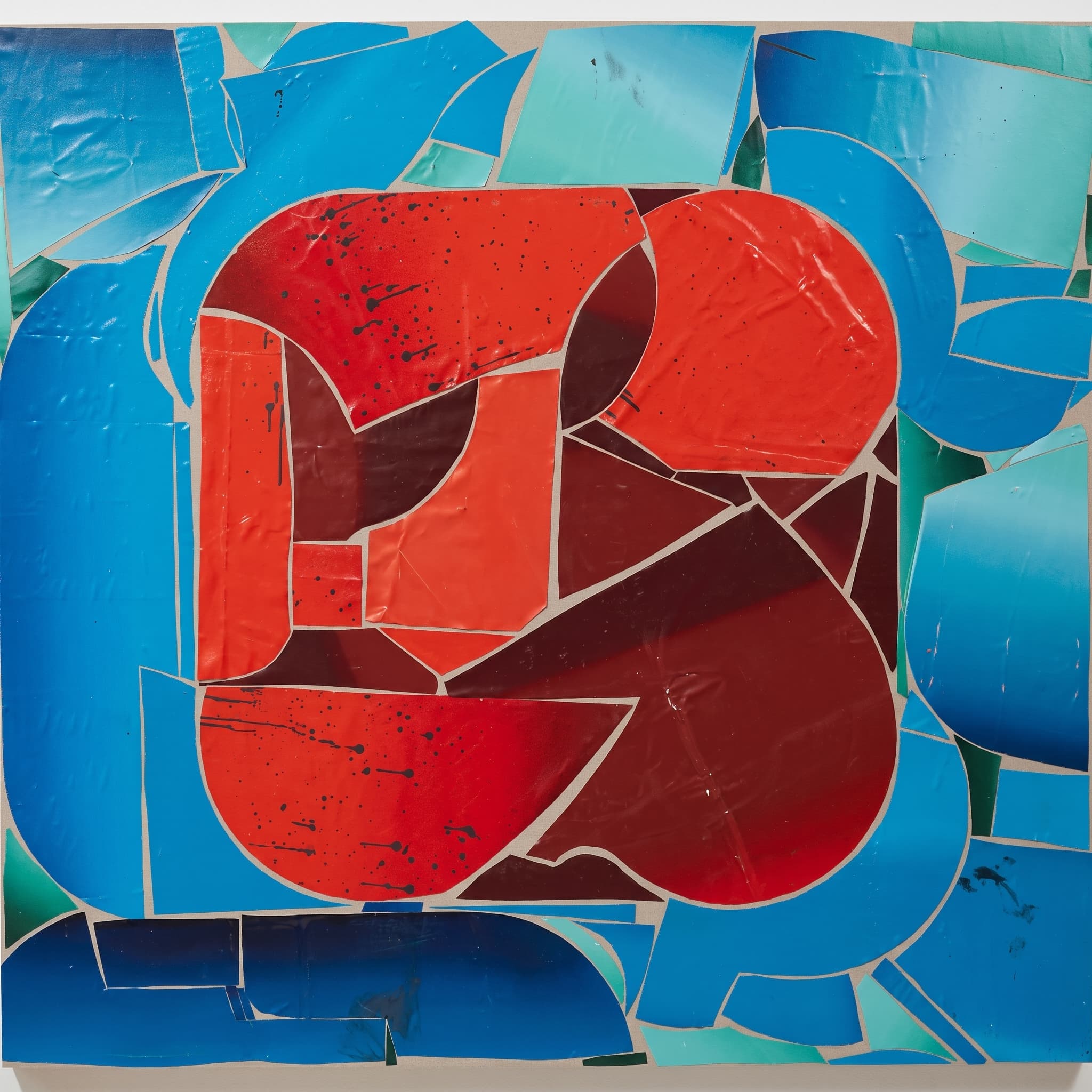Mosaic of cracked paint shards, a red-orange mass over blue fragments.